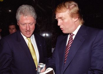 Donald Trump (R) shows a book to then U.S. President Bill Clinton at a fundraiser in New York, U.S. in this June 16, 2000 handout photo.     Courtesy William J. Clinton Presidential Library/Handout via REUTERS      ATTENTION EDITORS - THIS IMAGE WAS PROVIDED BY A THIRD PARTY. EDITORIAL USE ONLY. - HT1EC991NE3KP