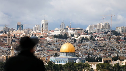 An ultra-Orthodox Jewish man is seen in the foreground as the Dome of the Rock, located in Jerusalem's Old City on the compound known to Muslims as Noble Sanctuary and to Jews as Temple Mount, is seen in the background February 15, 2017. REUTERS/Ammar Awad