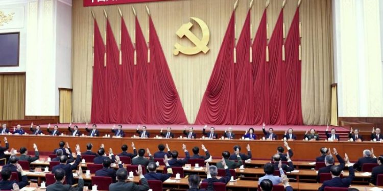 In this photo released by Xinhua News Agency, the Political Bureau of the Communist Party of China (CPC) Central Committee presides over the fifth plenary session of the 19th CPC Central Committee in Beijing, China on Oct 29, 2020. China's leaders are vowing to make their country a self-reliant "technology power" after a meeting to draft a development blueprint for the state-dominated economy over the next five years. (Yin Bogu/Xinhua via AP)