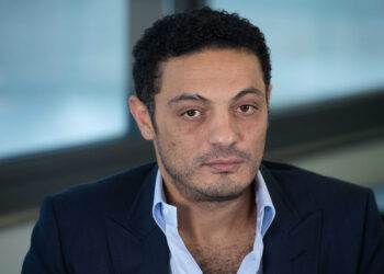 Egyptian self-exiled businessman Mohamed Ali looks on during an interview in an office near Barcelona on October 23, 2019. - Exiled Egyptian businessman, whose viral videos sparked rare small-scale protests in Egypt in September, says he is working with the opposition to topple President Abdel Fattah al-Sisi and calls for fresh demonstrations in the coming weeks. (Photo by Josep LAGO / AFP)