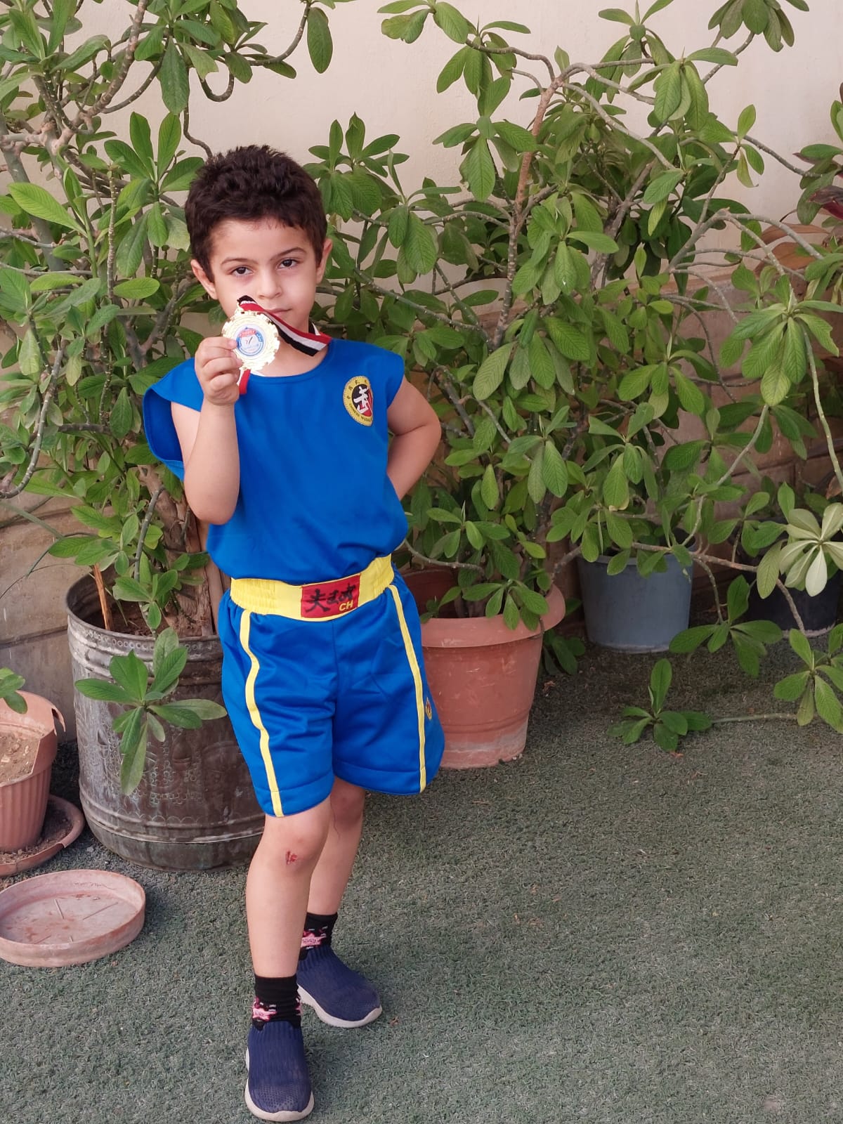 بالصور.. الطفل "أحمد السيد" ابن قرية عنيبس بطلا للجمهورية في لعبة "الكونغ فو" 2