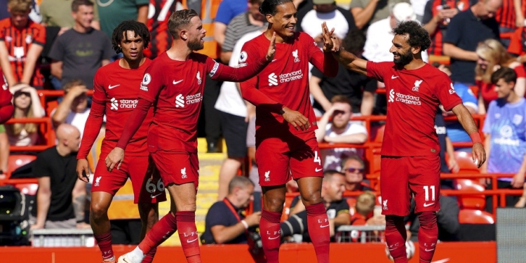 Liverpool's Virgil van Dijk, centre, celebrates scoring their side's fifth goal of the game during the English Premier League match between Liverpool and Bournemouth at Anfield stadium in Liverpool, England, Saturday Aug. 27, 2022. (Peter Byrne/PA via AP)